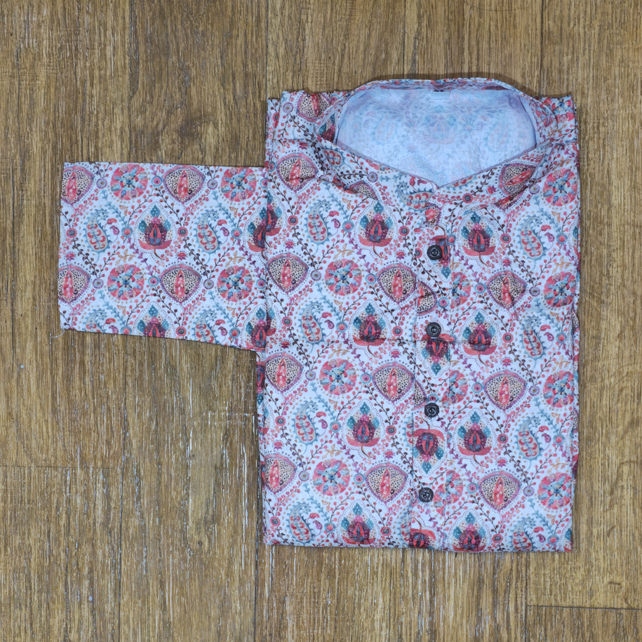 Folded mandarin collar shirt with multicolor floral and paisley block print on wooden floor