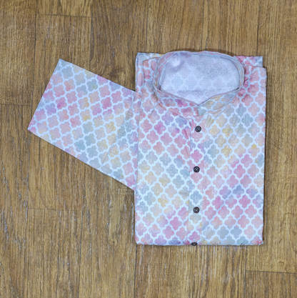Floral patterned shirt with a matching eye mask on a wooden surface