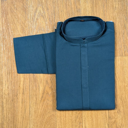 Folded Ocean Blue mandarin collar kurtawith brown buttons on wooden floor